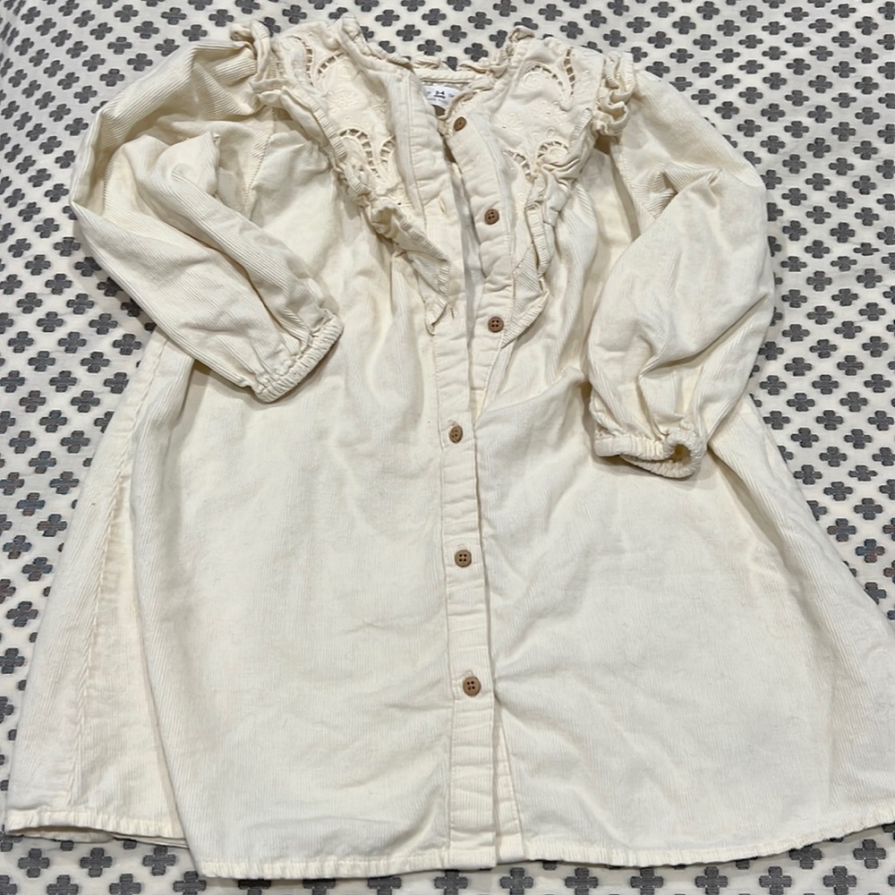 Cream corduroy embroidered dress.